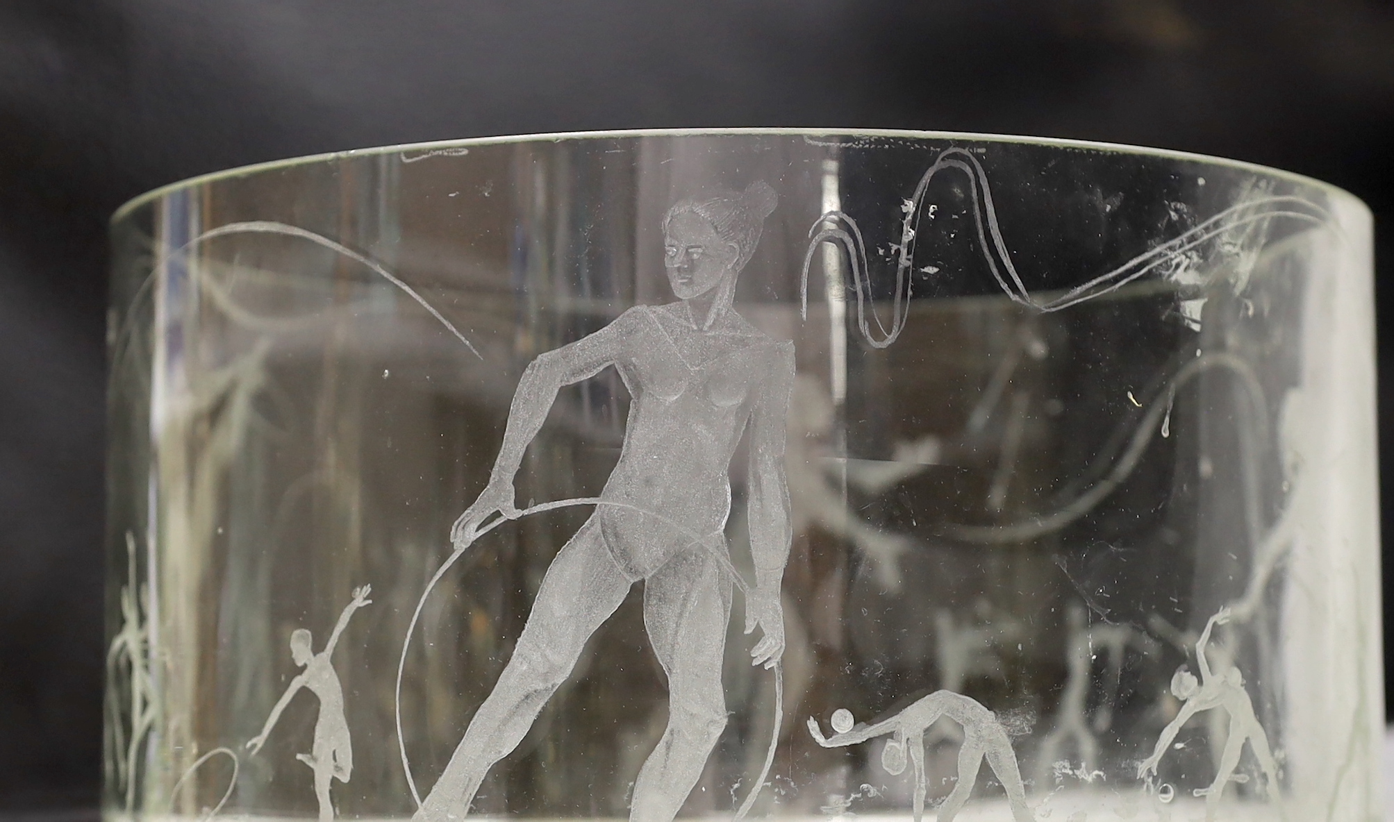 A large glass bowl engraved with artistic gymnastic scenes, 30cm diameter